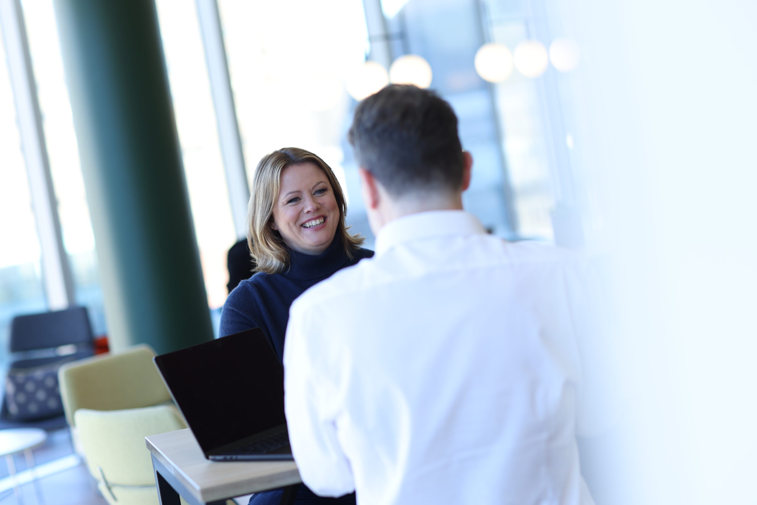 Ruth Badger sat down explaining the habits of successful people to a man